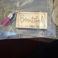 a bag with a name tag on it and a tassel hanging from the handle