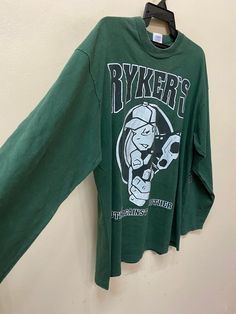 "Item :Vintage 90s ryker's longsleeve t shirt Armpit to Armpit :24\" Length :29\" XLarge metarials 100%cotton conditions used vintage refer to pics carefully made in ireland original / authentic ACCEPT PAYMENT: PAYPAL ONLY ALL ITEM WILL BE SHIPPED WITHIN 3-5 BUSINESS DAY AFTER RECEIVING CLEARED PAYMENT AND DELIVERED 3-5WEEKS WE ARE USING POST MALAYSIAN WITH YOUR TRACKING NUMBER. PLEASE LEAVE YOUR PHONE NUMBER DURING PURCHASE.PHONE NUMBER REQUIRES FOR MALAYSIAN POST (VERY IMPORTANT) THANKS FOR VI 90s Graphic Print Long Sleeve T-shirt, Y2k Oversized Long Sleeve Tops, Oversized Y2k Long Sleeve Top, Oversized Long Sleeve Y2k Top, Vintage Tops For Streetwear In Fall, Vintage Tops For Fall Streetwear, Vintage Long Sleeve T-shirt For Winter, Green Long Sleeve Y2k T-shirt, 90s Long Sleeve Tops For Streetwear