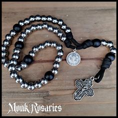 NEW! Handmade by us for our partner brand, Monk Rosaries™ Handmade in our studio Absolutely Beautiful Unique Crucifix Solid and weighty Solid Stainless Steel beads About 15 inches long Includes a drawstring carry pouch This handmade rosary won't fall apart or tangle on you. It will always be ready when you are. Recommended for anyone that wants a unique-looking rosary that you can easily carry in your pocket without worry of it breaking. The rugged but small design makes it easily portable - Len Rosary Prayers, Combat Rosary, Bible Catholic, Rugged Rosary, Paracord Rosary, Chi Rho, Rosary Prayer, St Benedict, Our Father