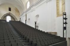 rows of empty seats in an old church