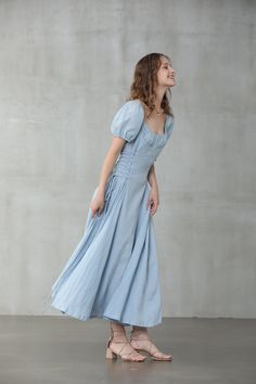 "Linennaive's versatile pieces work for a variety of occasions in effortless shapes and timeless designs. This seafoam-blue girdle dress is cut from a linen and silk-blend and has ruffled neckline and puff sleeve silk sleeves to enhance the breezy, easy-going silhouette. Whether you're going for a casual or classic look, this blue linen midi dress from Linennaive will match perfectly in either way. No doubt. 【Fabric】 Main100% linen, natural pure linen. Medium weight. It is washed with special te Elegant Cotton Midi Dress With Gathered Neckline, Fitted Linen A-line Maxi Dress, Fitted Square Neck Dress With Gathered Skirt, Fitted Maxi Dress With Gathered Neckline, Fitted Puff Sleeve Maxi Dress For Casual Occasions, Fitted Maxi Dress With Puff Sleeves For Casual Occasions, Maxi Dress With Ruched Bodice And Short Sleeves, Fitted Cotton Midi Dress With Gathered Sleeves, Fitted Cotton Maxi Dress With Gathered Sleeves