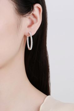 Our Rhodium-Plated Hoop Earrings are a must-have staple to your jewelry collection. Made with 925 sterling silver and moissanite, this style makes an elegant gesture to any outfit. Picture style: Ghost mannequin Style: Modern, minimalist Appearance: Round Material: 925 sterling silver, moissanite, rhodium-plated Craft: Polished Care: Avoid wearing during exercise, as sweat will react with the jewelry to produce silver chloride and copper sulfide. Imported Including: A matching boxNo certificate Cubic Zirconia Round Hoop Earrings, White Gold Cubic Zirconia Hoop Earrings For Pierced Ears, White Gold Cubic Zirconia Hoop Earrings, White Gold Hoop Earrings With Cubic Zirconia, Everyday Hoop Jewelry With Halo Design, Sterling Silver Halo Hoop Earrings, Everyday Halo Hoop Jewelry, Small Silver Hoop Earrings With Halo Design, Hypoallergenic Diamond Hoop Earrings