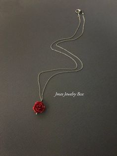 Dark red rose necklace. Red rose is on a delicate but sturdy 18'' stainless steel chain with lobster clasp. If you choose to add initials, please leave the initials in order left to right in the note to sellers box during checkout. *Necklace is available with 1,2 and 3 leaves *15mm Resin rose *Silver plated brass leaves *Stainless steel chain *Handmade with love <3 Like Jmesjewelrybox on Facebook for updates on new jewelry, upcoming sales and giveaways! Plus Facebook fans save 5% :D Find the Dainty Red Flower Necklace, Red Rose Necklaces For Gifts, Red Roses Necklaces For Gift, Red Rose Necklace For Gift, Red Flower Necklace With Rose Design, Red Flower-shaped Necklace With Rose Design, Rose Sterling Silver Jewelry For Valentine's Day, Gift Red Rose Necklaces, Red Stainless Steel Jewelry For Valentine's Day