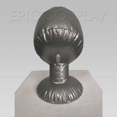 an egg shaped object sitting on top of a white pedestal with the word epicoplay