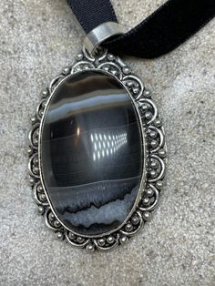 Vintage Silver Genuine Banded Black Onyx Agate Choker Black Velvet Ribbon Pendant Necklace https://www.etsy.com/listing/1030579635/vintage-silver-genuine-banded-black-onyx?utm_source=crowdfire&utm_medium=api&utm_campaign=api Silver Onyx Oval Pendant Jewelry, Vintage Black Jewelry With Natural Stones, Collectible Black Jewelry With Large Pendant, Silver Onyx Oval Pendant, Black Bohemian Collectible Jewelry, Collectible Black Bohemian Jewelry, Bohemian Black Collectible Jewelry, Vintage Silver Necklace With Large Stone, Antique Silver Agate Jewelry