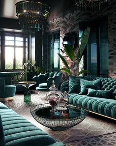 a living room filled with lots of green furniture