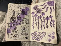 an open notebook with drawings on it