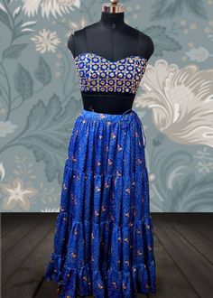 Blue bandhani print lehenga with faux mirror work bralette blouse and georgette dupatta Lehenga skirt Base fabric: Satin georgette  Details: bandani print Flare:7m , tiered design Lining: satin and cotton Blouse: faux mirrors dyed to match the lehenga in bralette style Lining: cotton Dupatta: blue georgette dupatta Size: Please choose a standard size from the drop-down or your can choose custom measurements. The dress will be made to order in the size you choose or for custom measurements, I'll Lehenga With Mirror Work, Faux Mirror, Sequin Lehenga, Print Lehenga, Bandhani Print, Mirror Work Lehenga, Embroidery Blouses, Multicolor Sequins, Under The Skirt