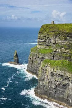 cliffs with grass growing on them near the ocean