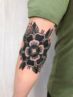 a person with a flower tattoo on their arm