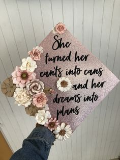 a graduation cap decorated with flowers and the words she found her counts into cans and her dreams into days