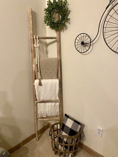 a bathroom with a ladder and towel rack