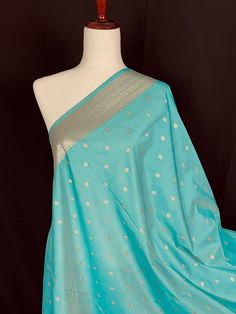 Beautiful Pastel Sea Blue Handmade Dupatta with Koniya design and small buttis all over the dupatta. Super Light weight and very easy to carry. Can be worn with a Suit or lehenga easily. Item: DupattaBase color : Sea Blue Zari Work : Muted Gold Fabric : Premium quality Banarasi Soft SilkWork : Zari Weaved with tasselsLength of the dupatta : 92 inches Width of the dupatta : 37 inches Store Policies - No return or exchange will be accepted for color variations. - No return or exchange will be acce Festive Blue Anarkali Set With Pallu, Blue Anarkali Set With Traditional Drape For Festivals, Blue Unstitched Anarkali Set With Traditional Drape, Blue Anarkali Set With Traditional Drape And Pallu, Blue Chanderi Anarkali Set With Pallu, Festive Blue Salwar Kameez With Cutdana, Festive Blue Cutdana Salwar Kameez, Blue Bollywood Anarkali Set With Pallu, Blue Salwar Kameez With Cutdana In Traditional Drape