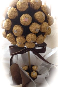 a bouquet of chocolates wrapped in brown ribbon