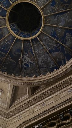 an ornately decorated ceiling in the center of a building with blue and gold paint