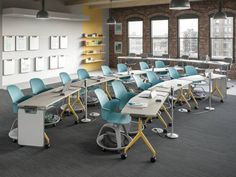 an empty classroom with desks and chairs