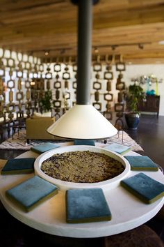 a table topped with a white bowl filled with food