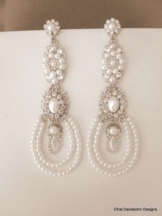 the earrings are made with pearls and crystal beads