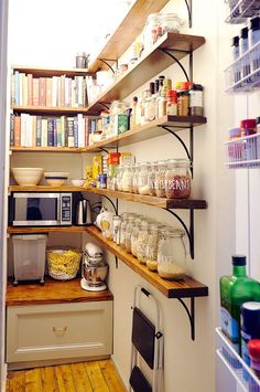 an open pantry with shelves full of food