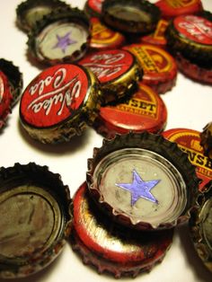 several bottle caps with the word coca - cola on them