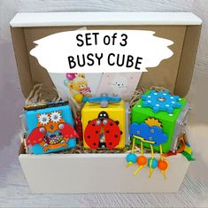 a set of 3 busy cubes in a box