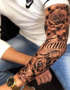 a man with a rose and name tattoo on his arm is sitting in front of the camera