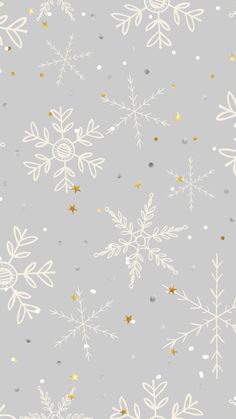 snowflakes on a gray background with gold and silver confetti in the foreground