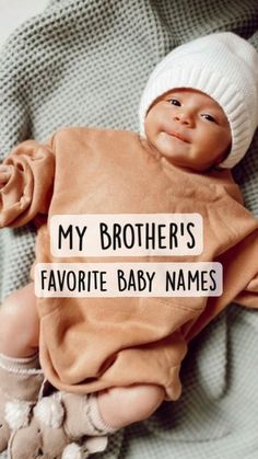 a baby wearing a brown shirt and hat with the words my brother's favorite baby names on it