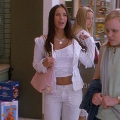 two women walking down the street talking to each other