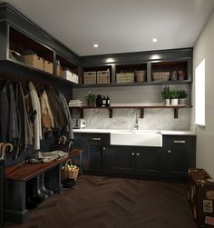 a kitchen filled with lots of wooden cabinets