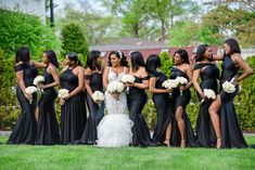 a group of women standing next to each other on top of a lush green field