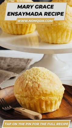 two muffins sitting on top of a white plate