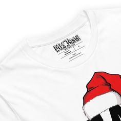 Let the world know you're on Santa’s VIP list with this hilarious Team Santa t-shirt, complete with a festive Santa hat. Whether it’s Christmas Eve, Christmas Day, or just a random Tuesday in December, this tee’s got your back! Perfect for matching family outfits during the holidays or rocking as a festive pajama top. Everyone will know you’re rolling with Team Santa—the ultimate squad! Get this funny festive tee and show everyone you’re Team Santa all the way!• 100% combed and ring-spun cotton White Graphic Tee For Winter, Funny Holiday T-shirt With Graphic Print, Funny White T-shirt For Holiday, Holiday White Pre-shrunk T-shirt, Funny White Winter T-shirt, Funny White T-shirt For Winter, Graphic Print T-shirt For Gift In Winter, Christmas Crew Neck T-shirt For Streetwear, Christmas Crew Neck Streetwear T-shirt