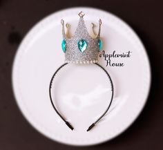 "White Queen Crown Headband,Alice in wonderland Queen  costume Silver and Aqua Blue Crown, Queen of hearts crown, Snow white Queen Halloween *Crown Size: 3\" x 4\" *Handmade by Applemint House since 2014 *Fits New Born to Adult ●HOW DO I MAKE A CROWN?● -My crown is made out of very soft plastic headband (the headband has teeth on it )as a base of the foundation. And I've added a cotton sheet with glitter sprinkled on top of it and as for the crown itself. It's made out of cotton and silver glitter to make it shine.  Inside the crown, it's padded to make it stand and durability for rough environment. ●WHAT IS SOFT PLASTIC HEADBAND?● -All Applemint House's Plastic Headbands are made out of flexible and very soft materials. It WON'T BREAK and WON'T HURT while wearing the headband for a long p Adjustable Princess Crown For Party, Silver Crown Headband For Party, Adjustable Princess Style Crown Headband, Adjustable Crown Headband For Birthday, Princess Crown For Party With Pinched Style, Silver Party Crown Hair Accessory, Silver Crown Hair Accessory For Party, Adjustable Silver Crown For Party, Adjustable Silver Crown For Parties