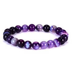 Product Description: The beads in a chakra bracelet can be made of many materials, but the colours are very important. Each of the chakras are represented by a colour - violet/white, indigo, light blues, green/pinks, yellows, orange and reds. The essential feature of a chakra bracelet is that the wearer understands its significance. Lava stone is porous and allows you to easily add a drop or two of your favorite essential oil. It is really easy to change up the scent because it wears off after a Spiritual Purple Round Beads Stretch Bracelet, Spiritual Purple Crystal Bracelet With Colorful Beads, Purple Round Beaded Bracelets For Meditation, Purple Beaded Bracelets For Meditation, Casual Purple Beaded Bracelets With 8mm Beads, Purple Round Beads Bracelet For Meditation, Purple Agate Bracelets, Purple Agate Beaded Bracelets As A Gift, Adjustable Purple Agate Beaded Bracelets