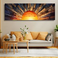 a living room filled with furniture and a painting on the wall above it's couch