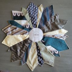 a bunch of ties that are laying on a table together with the name deben written on it