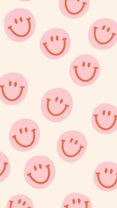 an orange and white background with many smiley faces on the bottom half of each face