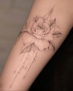 a rose tattoo on the right arm with stars and an arrow in the middle is shown