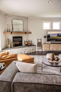 a living room filled with furniture and a fire place