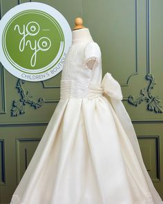 Nardo is an elegant and unique communion dress, it belongs to our deluxe line for a reason. It is made with a natural white mikado silk, and has spectacular lace details on the chest and skirt. The floral appliqué is removable. The dress has buttons on the back for closure, and strings to form a bow. Made in Spain Does not include crinoline Dry Clean Final sale, no exchanges nor returns are available Mikado Silk, Holy Communion Dresses, First Communion Dress, First Communion Dresses, Baptism Dress, Dresses For Girls, Communion Dresses, Christening Gowns, Children's Boutique