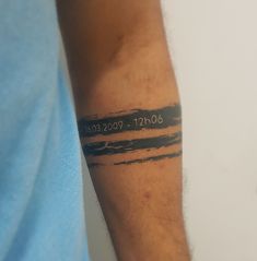 a man with a tattoo on his arm that reads 30 / 11 / 2009 - 2010