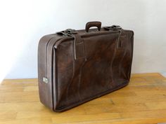 Brown Leather Suitcase, Travel Luggage, Feaux Leather Valise, Suitcase Table, Luggage Bag A vintage (1980) travel suitcase,covered with feux leather in Brown colour. The suitcase is in very good condition (used) with some rustic spots upon metal parts.. The interior part is good (used) condition. Please check all photos.. Feaux Leather Suitcase Dimensions: Base : 81 x 48 cm or 31.88 x 18.89 inches Height: 16 cm or 6.29 inches Weights about 4000 gr For Antique and Retro Suitcases, Antique and Res Brown Rectangular Cases For Trip, Rectangular Brown Cases For Trip, Brown Rectangular Cases For Trips, Brown Cases With Luggage Sleeve For Trip, Cardboard Suitcase, Suitcase Table, Brown Luggage, Trunk Luggage, Suitcase Travel