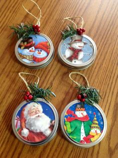 four christmas ornaments hanging on a wooden table