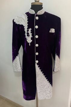 DESCRIPTION [-] Walk in with panache and grace in this aristocratic purple wedding sherwani. Try out this latest sherwani with silver zardosi embroidery. Colour options available. Material options available Customisation available. Elegant Purple Kurta With Pallu, Groom's Long Sleeve Embroidered Sherwani, Elegant Purple Dabka Salwar Kameez, Elegant Groom's Nehru Jacket With Dabka Work, Traditional Drape Purple Kurta With Dabka, Elegant Purple Unstitched Suit For Formal Occasions, Elegant Formal Purple Unstitched Suit, Formal Purple Salwar Kameez With Dabka Work, Formal Purple Unstitched Suit With Dabka Work