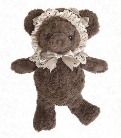 a brown teddy bear wearing a white lace collar