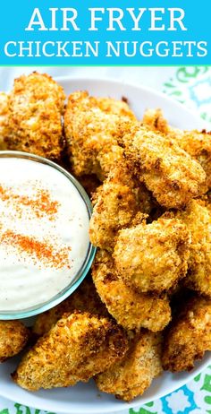 air fryer chicken nuggets on a plate with ranch dip in the middle