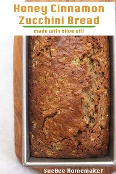 a loaf of honey cinnamon zucchini bread in a pan