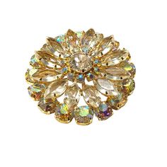 Luxuriously crafted , this 2" diameter, 0.25" deep Vintage   Rhinestone Crystal Wreath Brooch displays the vibrant Aurora Borealis for a classic, elegant look. The setting is solid gold-tone-brass and has a secure functioning pin. Perfectly preserved in its condition, this circular faceted pin will bring a unique touch to any outfit. AB bead treatments were invented by Swarovski back in 1956, in partnership with Christian Dior. Gold Jeweled Brooches For Wedding, Gold Crystal Brooch Jewelry, Gold Crystal Brooches For Formal Occasions, Gold Crystal Jewelry With Brooch, Gold Round Brooches For Wedding, Gold Wedding Brooch, Gold Crystal Jeweled Brooches, Gold Round Costume Jewelry Brooches, Gold Wedding Pins