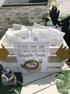 there is a sign that says please take one to crush with your terrible tea on the table